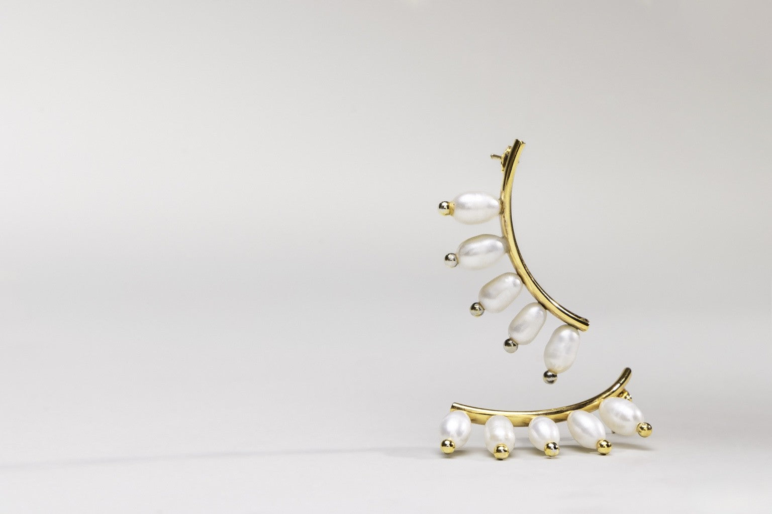 Design Diary: The Arco Earrings - From Sketch to Jawline